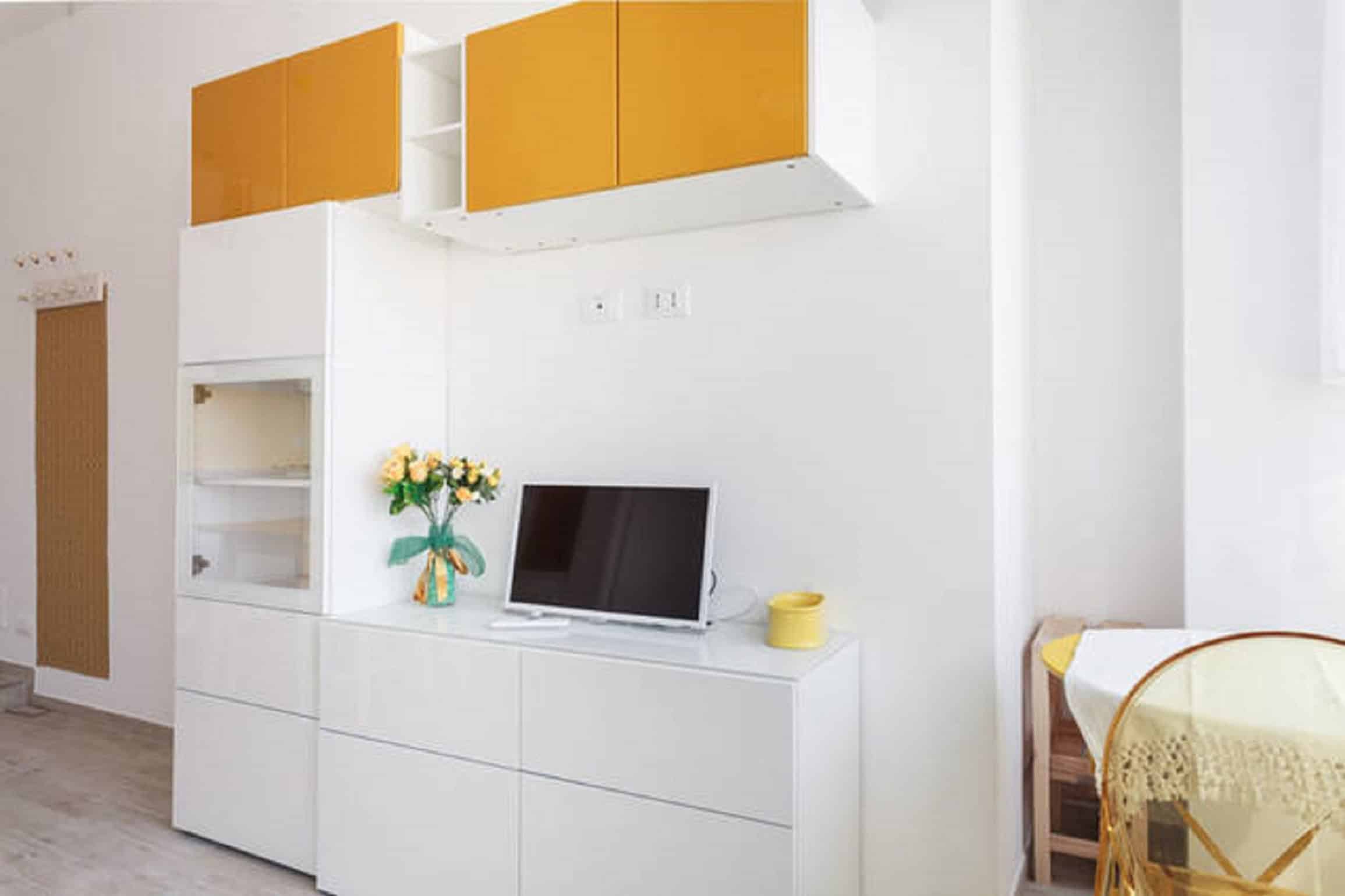 Riva Reno Apartment Modern white and yellow interior design - Riva Reno Apartment