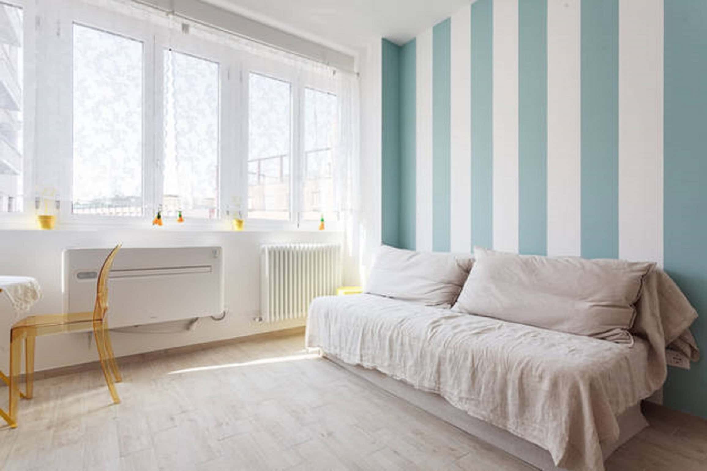 Riva Reno Apartment Bright room with striped walls - Riva Reno Apartment